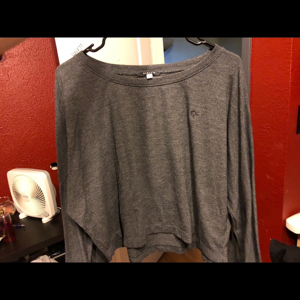 Woman’s gray obey Bell sleeve sweater